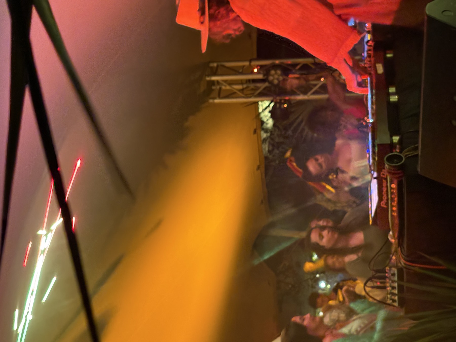 DJ performing on Pioneer equipment to a packed tent