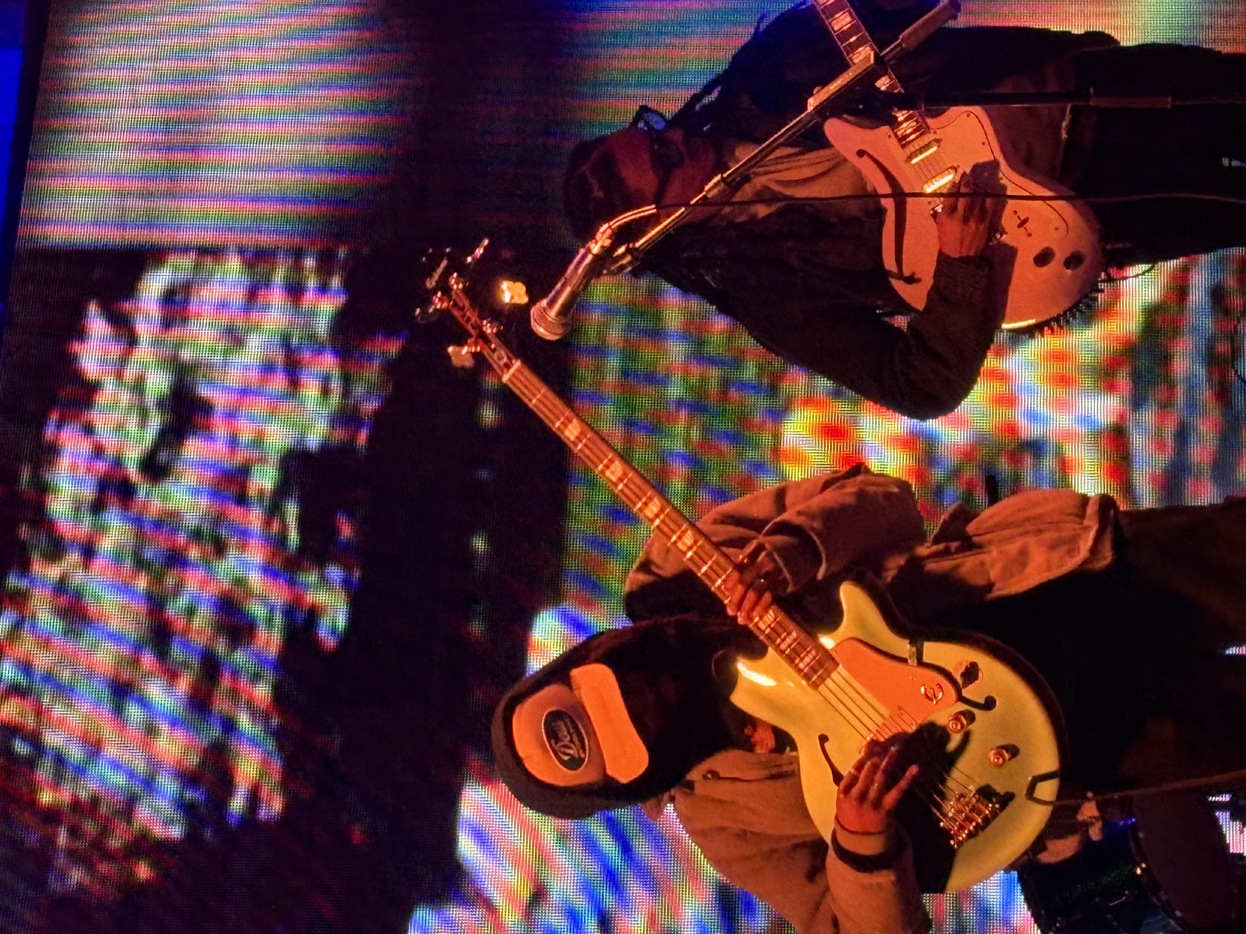 Band performing in front of a large LED video wall